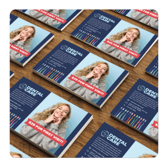 Stacks of postcards for a dentist office direct mail campaign with a woman smiling and a discount